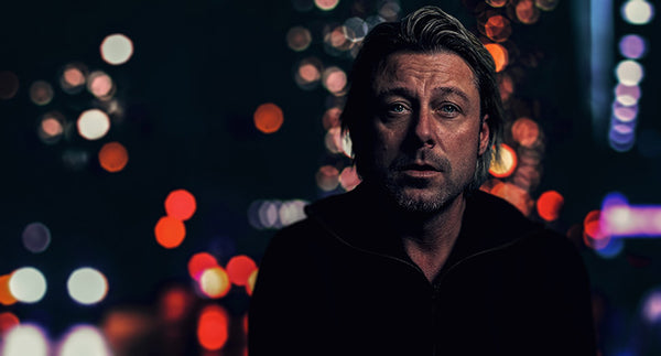 man with stubble in a liminal space