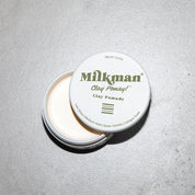 matte clay pomade (Clay Pomay) by Milkman Grooming co on grey background