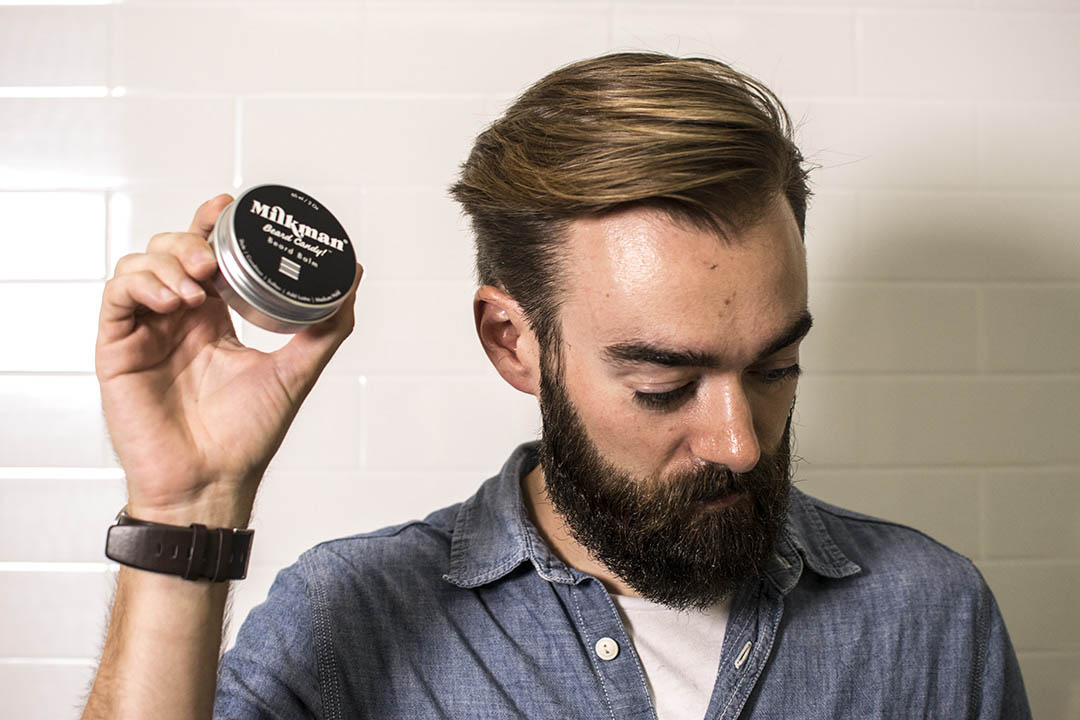 man holding milkman beard balm